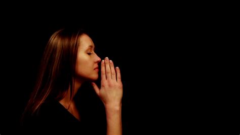 Woman Praying On A Black Background Stock Video Footage 0023 Sbv