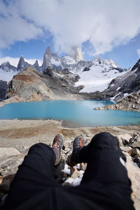 Sitting On The Edge Of Patagonias Laguna De Los Tres In El Chaltén