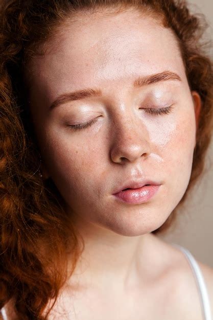 premium photo beautiful redhead girl sprayed thermal water on her face skin care concept