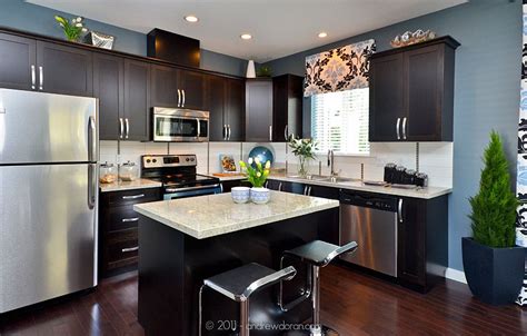 However, it is best to opt for countertops in brown or tan color that are unveined granite. granite countertops. dark cabinets. stainless steel ...