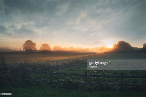 Beautiful Sunrise Over Misty Field An Early Summer Morning High Res