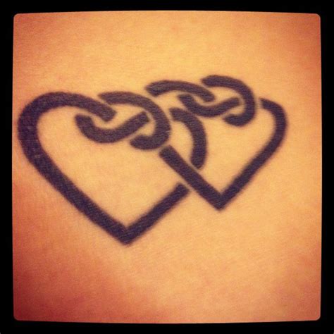 27 Inspiration Intertwined Heart Tattoo Designs