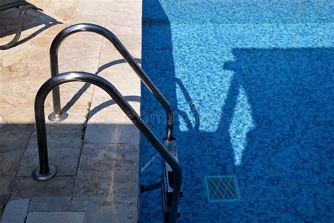 Handrail On Pool Swimming Pool With Stair At Tropical Resort Pool