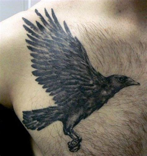 natural looking colored flying crow tattoo on chest tattooimages