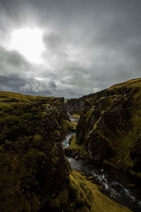 Deep Canyon Steep Cliffs Overgrown With Green Moss Surrounded By A