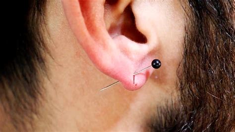 How Painful Is Piercing Your Ear Youtube