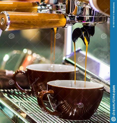 Espresso Machine Pouring Fresh Coffee Into Cups At Local Coffee Shop