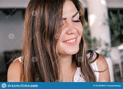Portrait On The Side Of A Young Beautiful Smiling Tanned Brunette With Her Eyes Closed A Happy