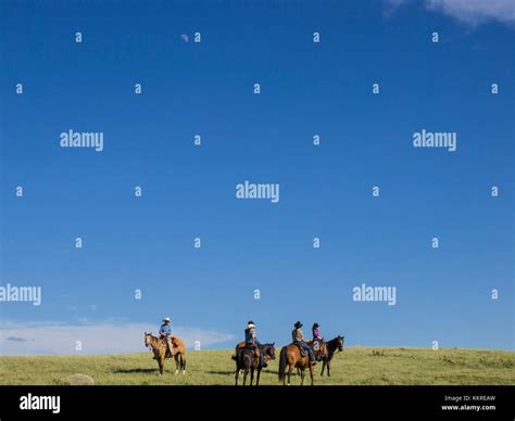 Horseback Riders On Dude Ranch Stock Photo Alamy