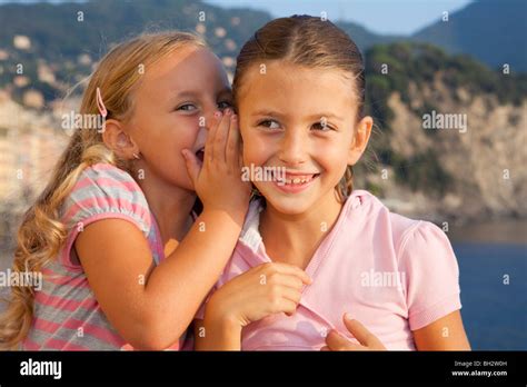 Two Girls Whispering Stock Photo Alamy