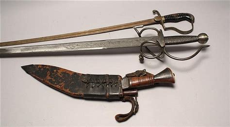 Lot Three Edged Weapons A German Wwi Sword Heavily Rusted A