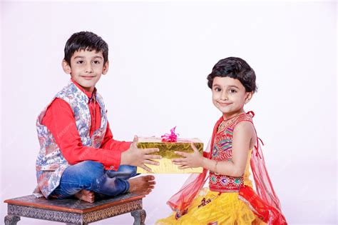 Premium Photo Cute Indian Brother And Sister Celebrating Raksha Bandhan Festival