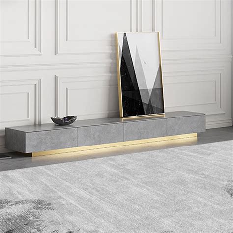 A Sleek Stone Top And Stand With A Brushed Gold Base Adds An Italian