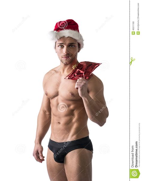 Christmas Season Muscular Bodybuilder In Santa Claus Hat Stock Photo