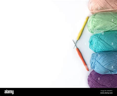 Multi Colored Wools And Knitting Needles On White Background Stock