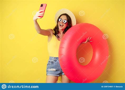 Stylish Brunette Girl On Vacation Taking Selfie With Swim Ring Going On Beach Swimming In Sea