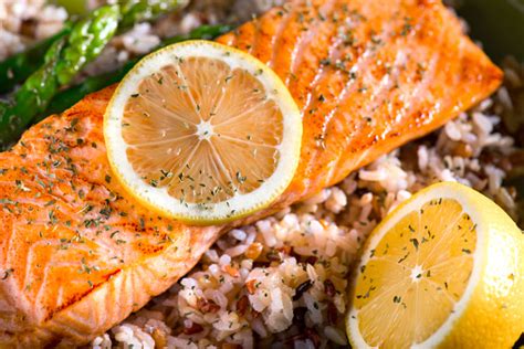 Grilled Salmon Dinner Over Brown Rice And Wild Rice Stock Photo
