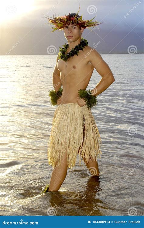 Handsome Male Hula Dancer Stands In The Water As The Sun Sets Stock Image Image Of Costume