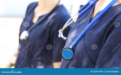 Nurses Or Doctors In Blue Scrubs With Stethoscopes Stock Photo Image