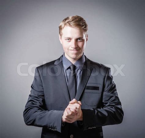Man Holds His Hands Folded Stock Photo Colourbox