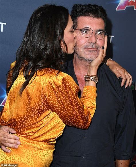 simon cowell is showered with kisses by girlfriend lauren silverman simon cowell america s