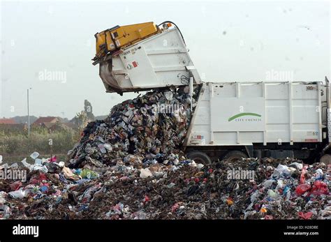 Refuse Lorry Dumping Rubbish At A Landfill Site Stock Photo Alamy