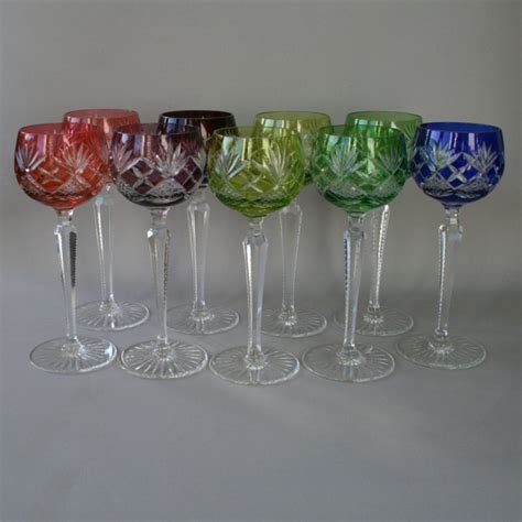 A Set Of Nine Multi Coloured Cut Glass Crystal Hock Or Wine Glasses