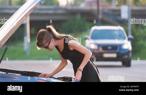 Woman Bonnet Car Stock Videos And Footage Hd And 4k Video Clips Alamy