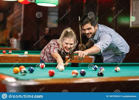 Download 8 ball pool for your device. Billiard- Smiling Couple Shooting Pool Ball Stock Photo ...