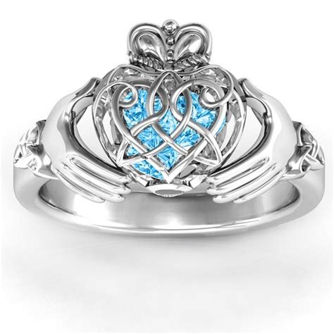 There's also a section that clearly explains how to wear the claddagh ring, depending on whether you're engaged, single, in a relationship or married. Sterling Silver Caged Hearts Celtic Claddagh Ring with 3 ...