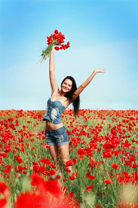 girl in poppies field beautiful brunette woman jumping in poppy field poppy field flower