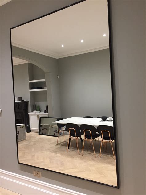 A Bespoke Black Framed Mirror Installed At A Customers Property