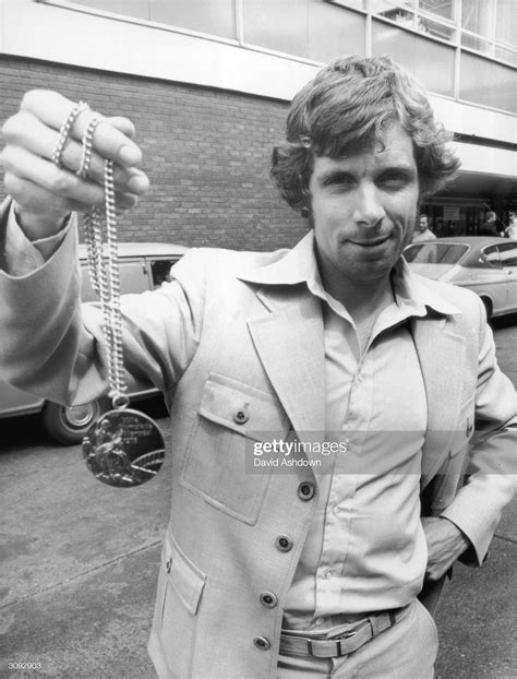 News Photo British Long Distance Runner Brendan Foster Shows Long