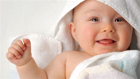 Smiley Cute Baby Boy Is Lying Down On Fur Cloth Wearing Dres Atelier