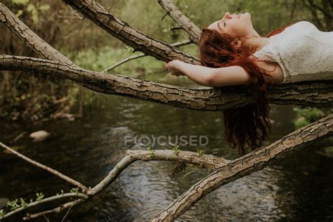 Ginger Girl Lying On Bending Over River Tree Branch — Forest