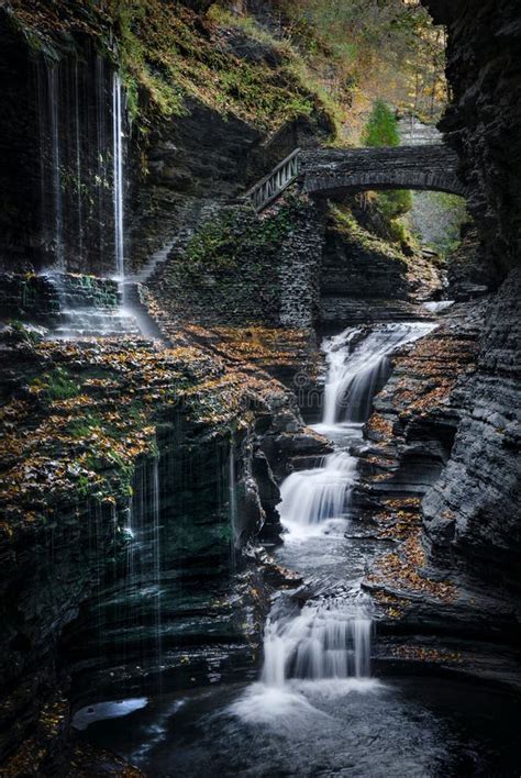Vertical Long Exposure Scenic View Of The Waterfalls Falling Down A