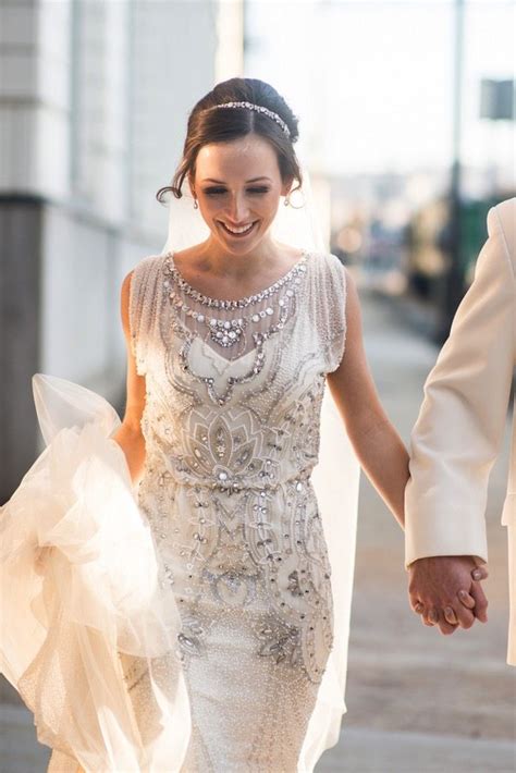 Amazing, elegant and delicate wedding gown, featuring leaves embellishments. Roaring 20s Wedding | Allison + Chris | Deco Weddings