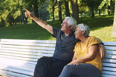 Elderly Couple Talking Resting Sit On Bench In Park Stock Image Image