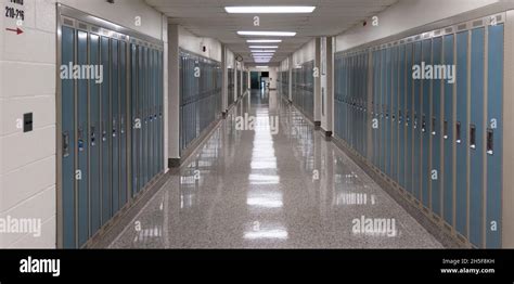 American High School Hallway Lined With Lockers And Lights Reflectin On