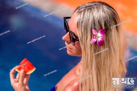 Young Slim Blonde Woman With Long Hair In Sunglasses Eat Watermelon And