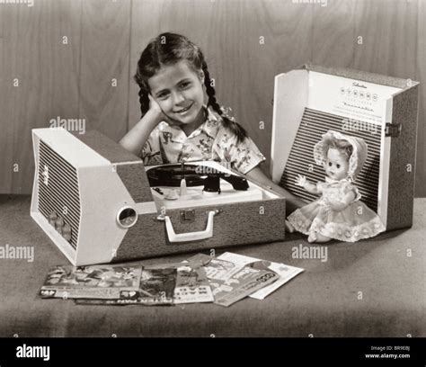 1950s Smiling Girl Listening To Portable Record Player Stock Photo Alamy