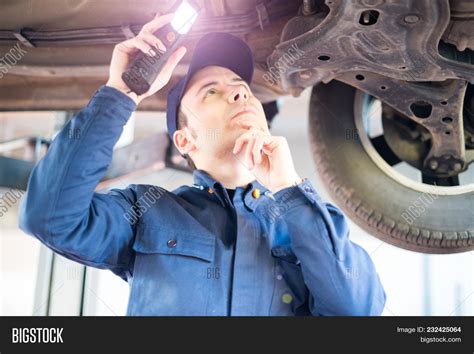 Mechanic Inspecting Image And Photo Free Trial Bigstock