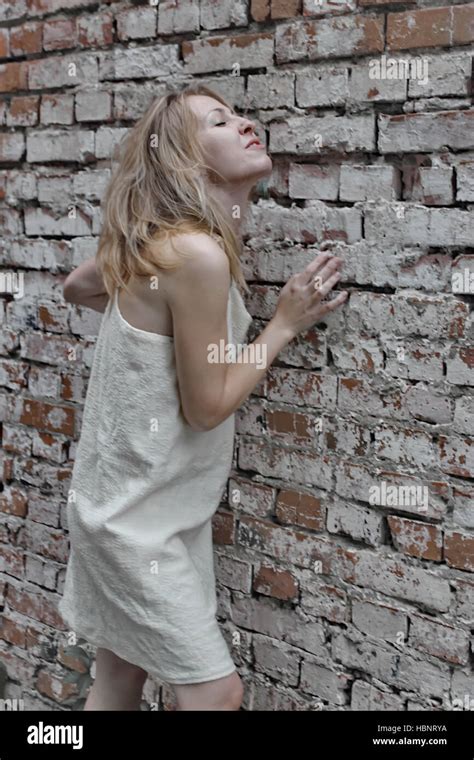 Girl Brick Wall Stock Photo Alamy