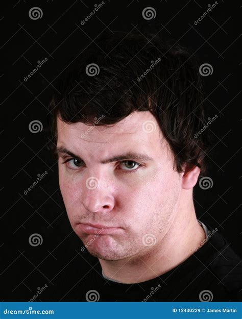 Young Man Scowling Stock Image Image Of Distressed Annoyed 12430229