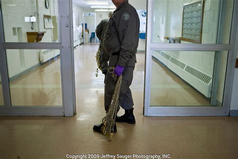 Corrections Officers Carry Chains Into Deerfield Correctional Facility Before Transporting The