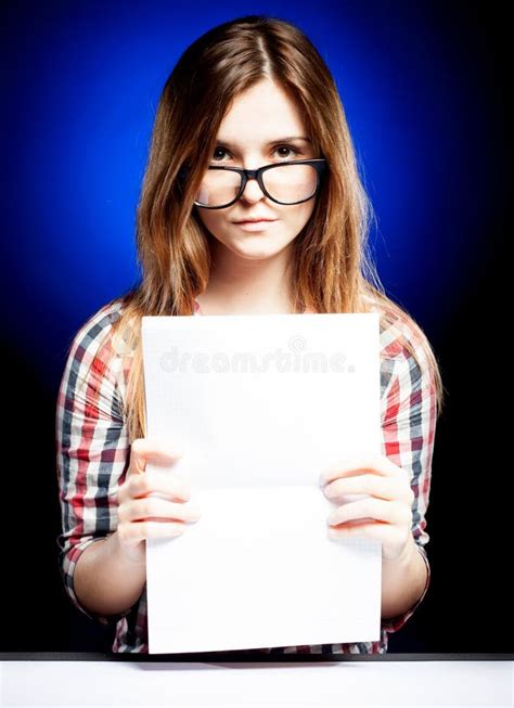 Sad Young Girl With Nerd Glasses And Open Exercise Book Stock Photo