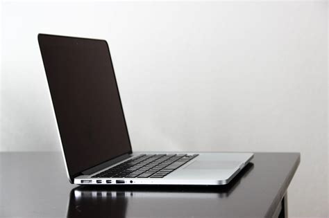 Free Stock Photo Of Open Macbook Laptop On Dark Glossy Table