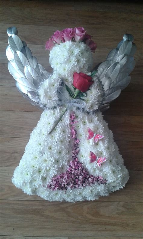 The type of funeral flowers is not a noticeable factor for the chinese funeral and you can easily make the choice of any type of flowers which you think that are a rather uniform set of funerary features emerged in the ming and qing dynasties, and some of those elements continue to this day. Angel tribute in white and pink #funeralflowers | Funeral ...