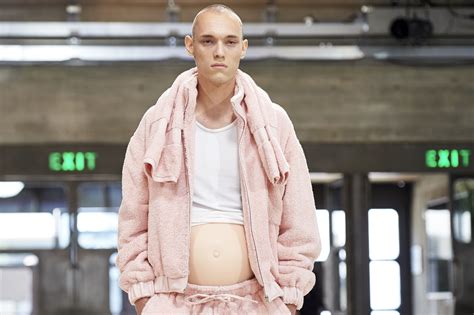 models with fake pregnant bellies walked the runway at london men s