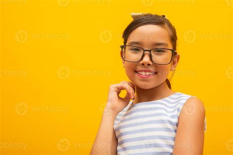 Beautiful Asian Girl Sitting On Yellow Background Happy Little Asian
